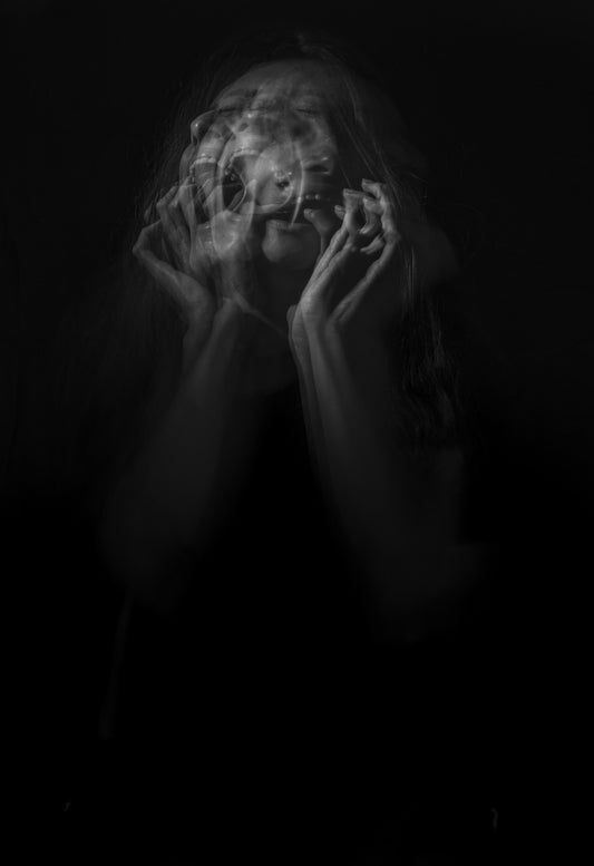 A black and white photo of a woman screaming